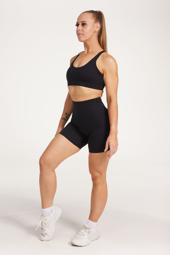 high waisted gym shorts, in buttery soft, supportive fabric with 6 inch inseam and no front rise seam, in black