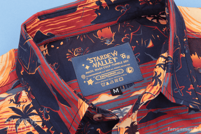 The tag for the shirt, showing the Stardew Valley logo as well as care instructions—machine wash cold, tumble dry.