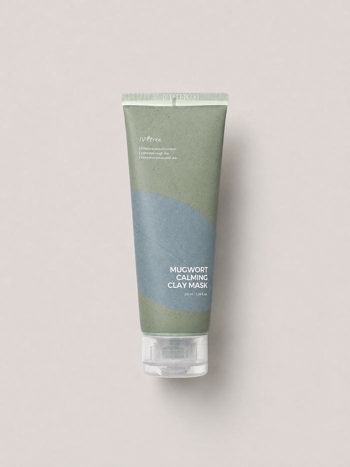 A korean skincare tube of Isntree Mugwort Calming Clay Mask, featuring a sage green and dusty blue color-blocked design with a clear cap, set against a solid light gray background. 100 ml.