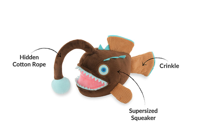 Play's Ocean Buddies Angler fish-shaped dog toy with labeled features on a white background