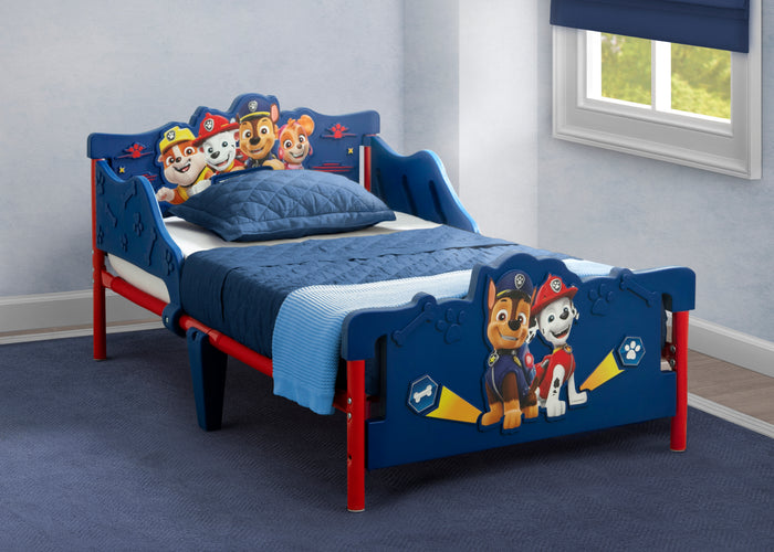 Children's bed with Paw Patrol theme in a room with a window.