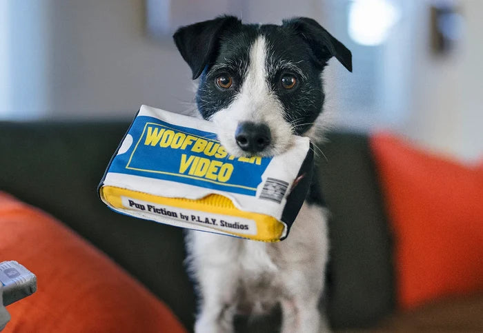 P.L.A.Y. 90s Classics Collection - Woofbuster Video Toy in black and white dog's mouth staring into the camera
