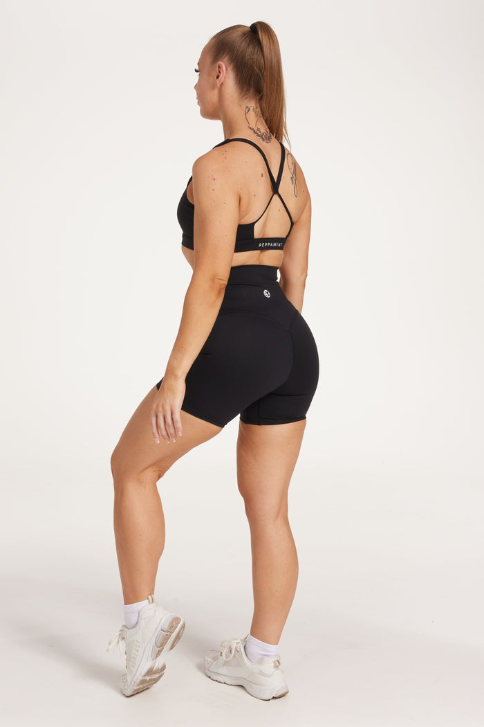 high waisted gym shorts, in buttery soft, supportive fabric with 6 inch inseam and no front rise seam, in black