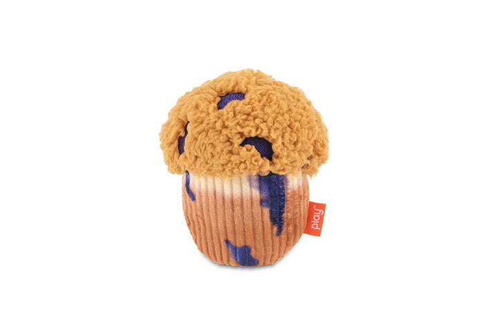 Play Berry Blast Muffin, a plush muffin-shaped dog toy with a textured golden-brown top and blueberry details, shown on a plain white background.