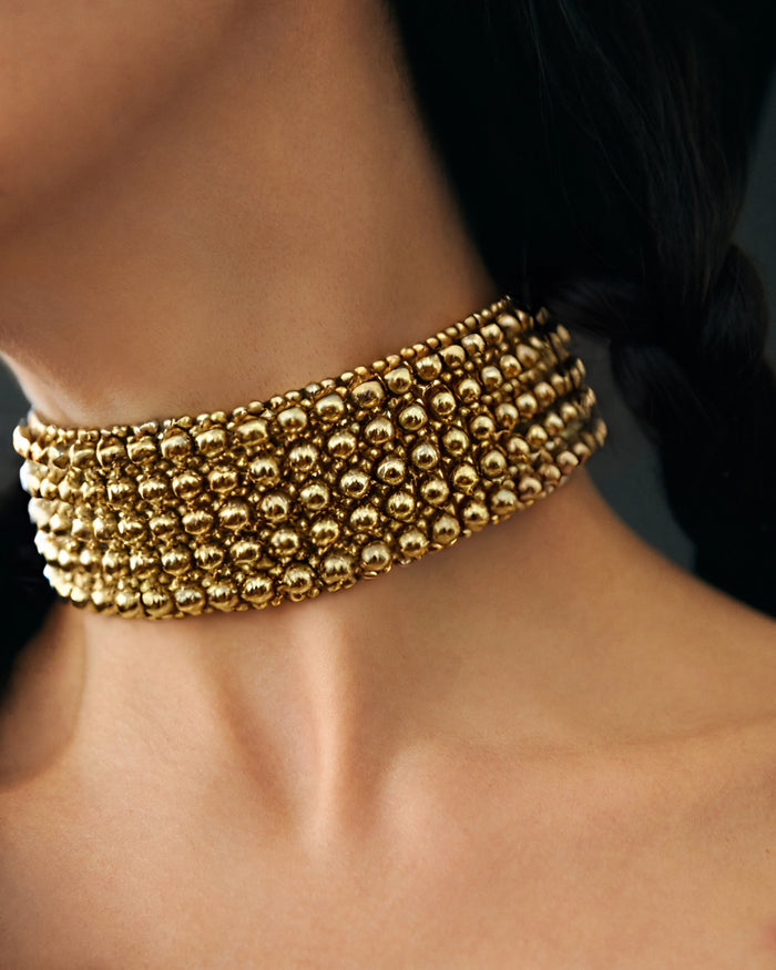 close up of celestial beaded choker gold by object and dawn side view