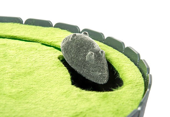 Feline Frenzy Peek-a-boo Mouse Interactive Cat Toy with close up of mouse popping out of opening surrounded by green turf.
