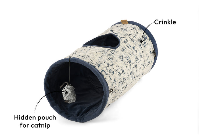 Feline Frenzy Purr & Pounce Cat Tunnel in Navy Blue Celestial print, shown on a diagonal with a dangling mouse and feature callouts on a white background.