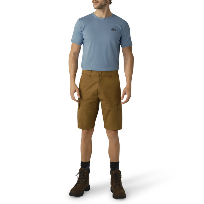 Man wearing blue t-shirt and brown cargo shorts with side pockets, paired with dark boots.