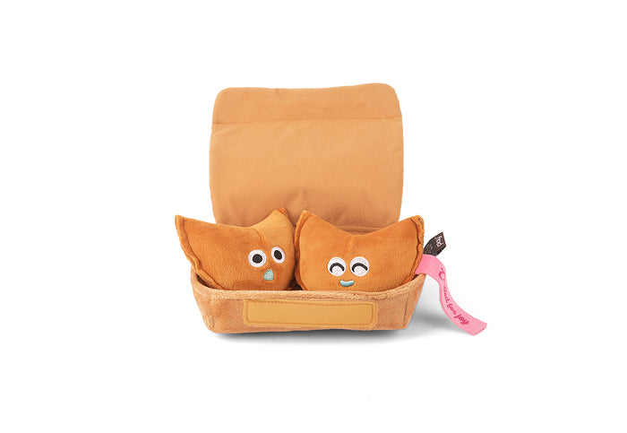 Fog City Pet x Play Lucky Treats dog toy showing two plush toys resembling fortune cookies in a brown takeout box on a white background