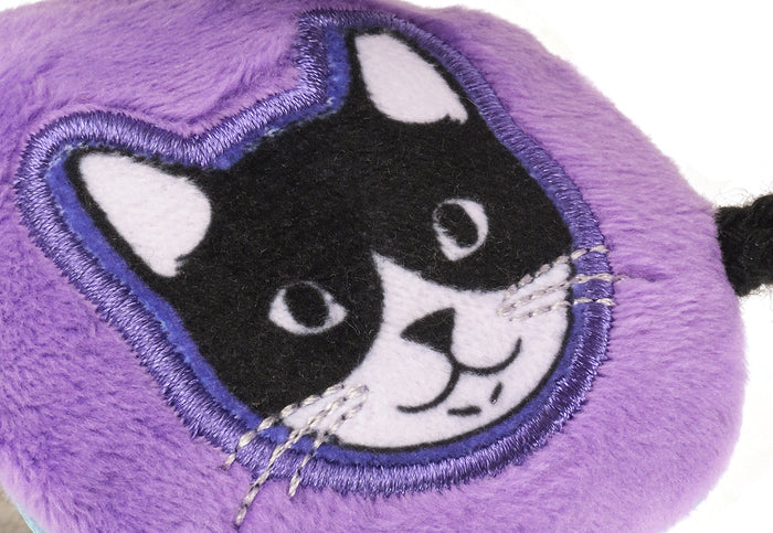 A close-up of the purple headphones featuring an embroidered Mojo the cat, from the Jackson Galaxy x Feline Frenzy Mic Drop Duo.