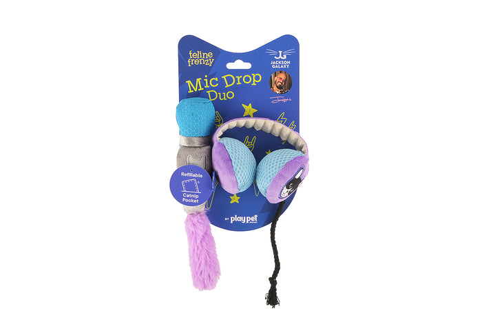 A packaged Jackson Galaxy x Feline Frenzy Mic Drop Duo on a white background. The set includes a blue and gray microphone-shaped toy with a pink tassel and a pair of purple and blue headphones.