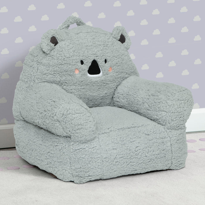 Gray bear-shaped bean bag chair against a purple wall with cloud pattern