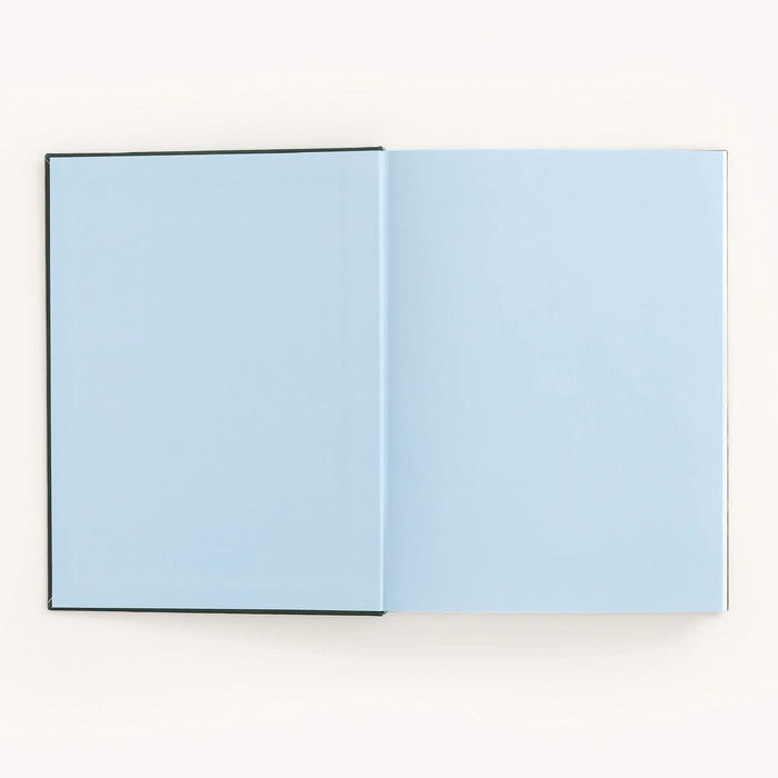Open book with light blue pages on a white background