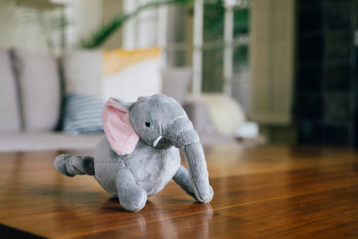 P.L.A.Y. Big Five of Africa gray elephant mini plush toy on a wooden table with a blurred indoor background
