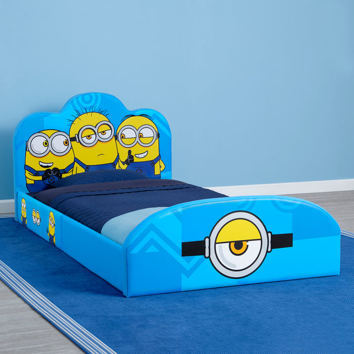 Children's bed with Minions design on a blue background