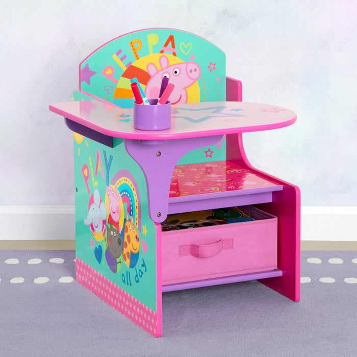 A pink chair and desk with storage bin, featuring colorful graphics of Peppa Pig and her friends.
