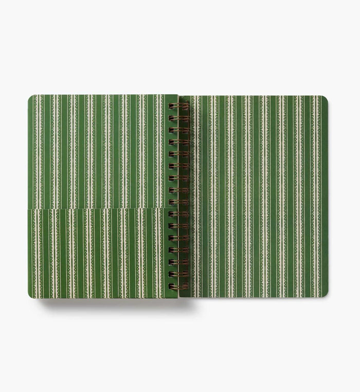 Notebook with green and beige striped cover on a white background