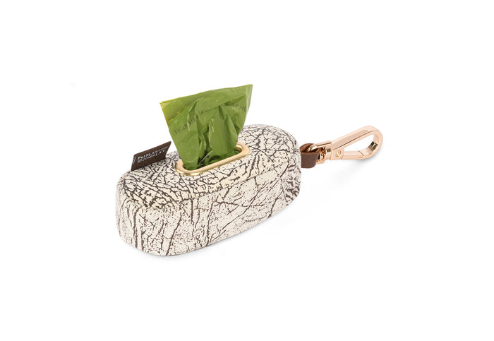 Proper Pup Poop Bag Dispensers from P.L.A.Y. - Savannah print shown with poop bags sticking out