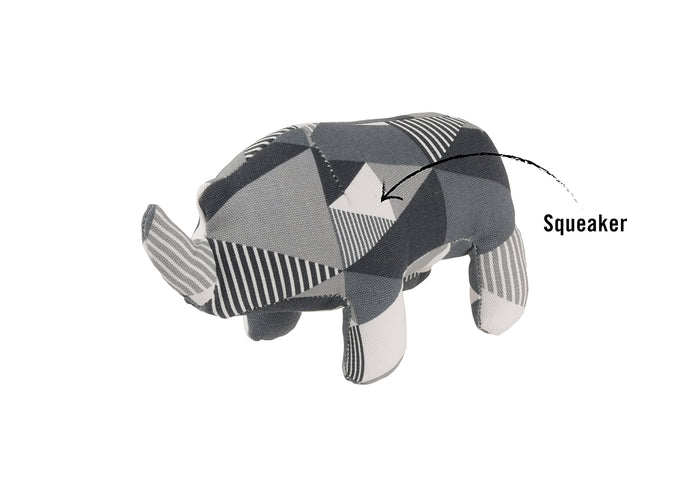 P.L.A.Y.’s Upcycled Zoo Pal Rhino Gray and white patterned dog toy with a squeaker pointed out by an arrow on a white background