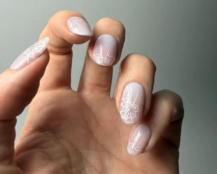 Pink Widow semi-cured gel nail wraps worn on a hand