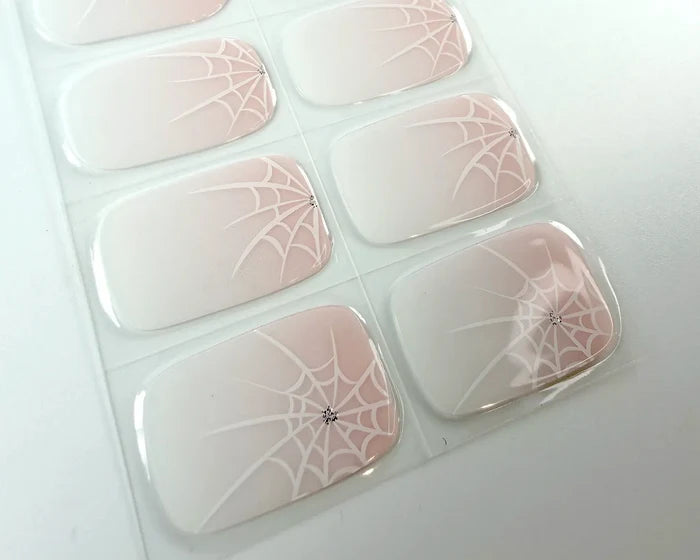 Close-up of the Pink Widow spider web nail design