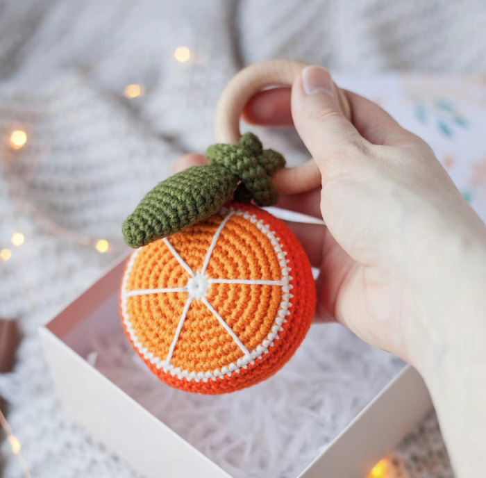 Split Orange Rattle Teething Toy
