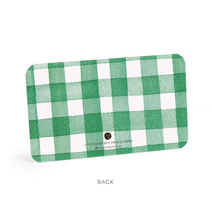 Green and white checkered card with brand name on a white background