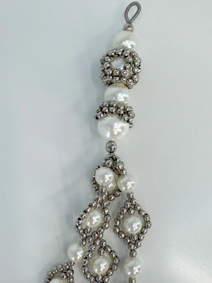 ghost image handcrafted modular trinity medallions in pearl by object and dawn close up