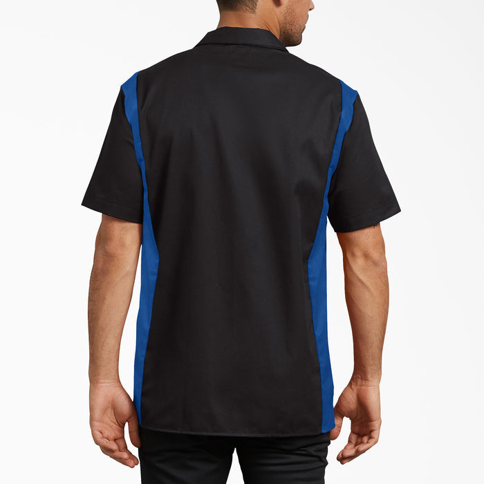 Black and blue short sleeve work shirt with color-blocked sides, shown from back view on male model.