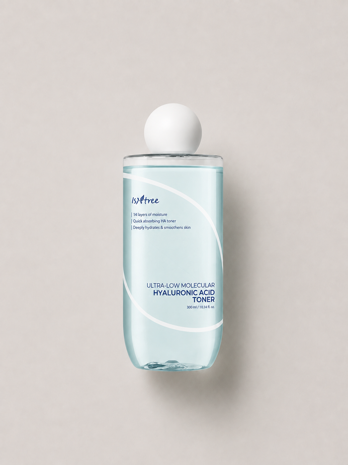 A bottle of korean skincare - Isntree Ultra-Low Molecular Hyaluronic Acid Toner with a white spherical cap, set against a solid light gray background. 300 ml.