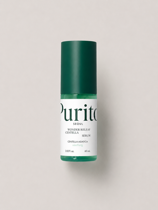 A korean skincare serum - Purito Seoul Wonder Releaf Centella Serum, featuring a dark green cap and a white label with green text, set against a solid light gray background. 60 ml.