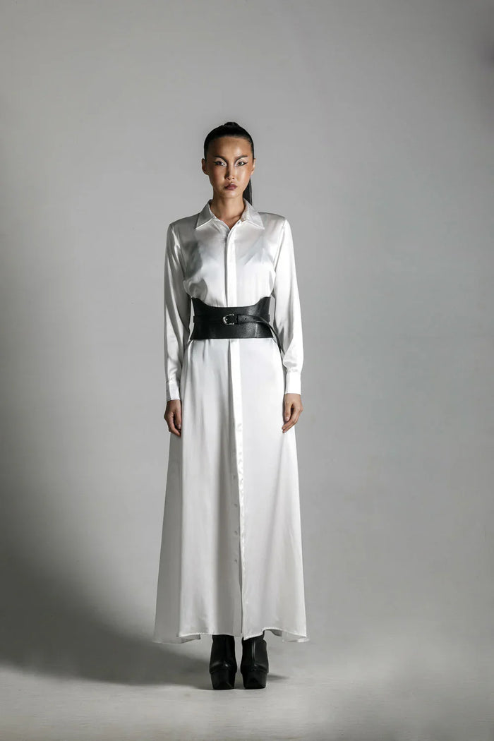 woman wears anais long sleeve silk shirt dress with corset belt by object & dawn in neutral background